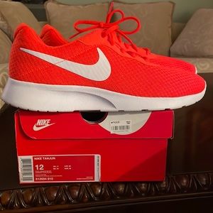 Brand New Men’s size 12 Nike Tanjun still in the box, tangerine color.